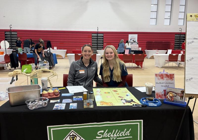 Carousel Slide 6: Our amazing Dr. Eckart and technician student, Shea, at the LMS Career Fair!